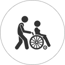 A man and woman in a wheelchair.